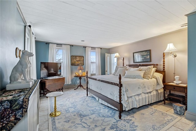 bedroom with light tile patterned floors