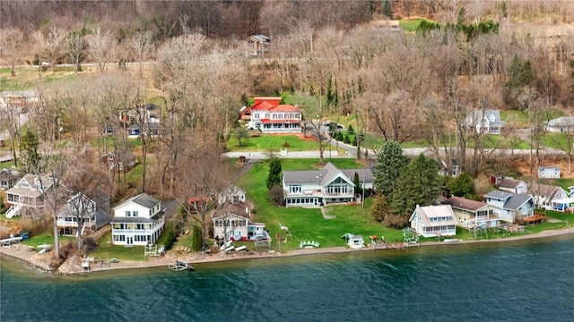 birds eye view of property with a residential view and a water view