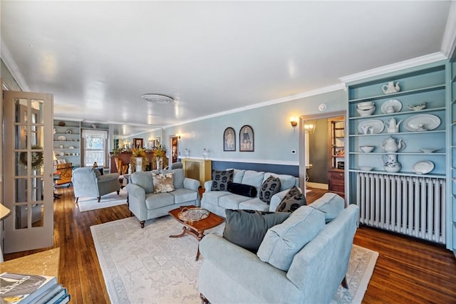 living room with ornamental molding, radiator heating unit, and dark wood-style floors