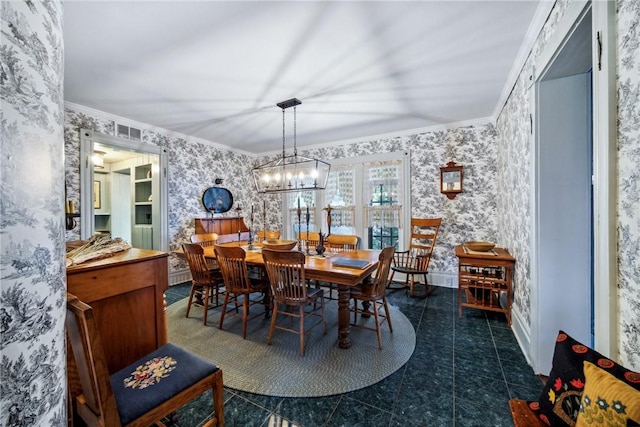 dining area featuring a chandelier, wallpapered walls, and crown molding