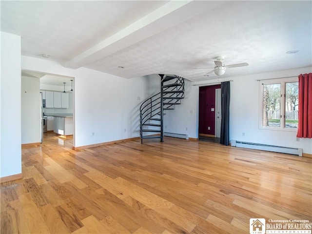 unfurnished living room with light wood-style floors, baseboards, a baseboard radiator, stairs, and ceiling fan