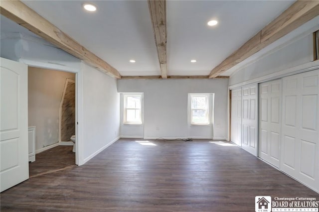 unfurnished bedroom featuring dark wood finished floors, baseboards, recessed lighting, beamed ceiling, and a closet