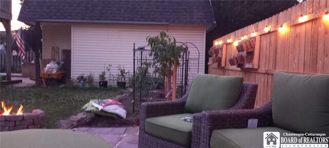 view of patio / terrace with a fire pit