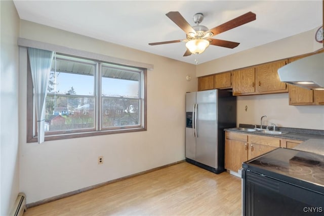 kitchen with baseboard heating, black electric range, stainless steel fridge with ice dispenser, a sink, and light wood finished floors