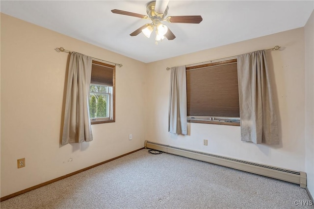 empty room featuring carpet, baseboards, baseboard heating, and a ceiling fan