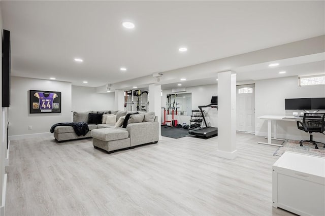 living room with recessed lighting, light wood-type flooring, and baseboards