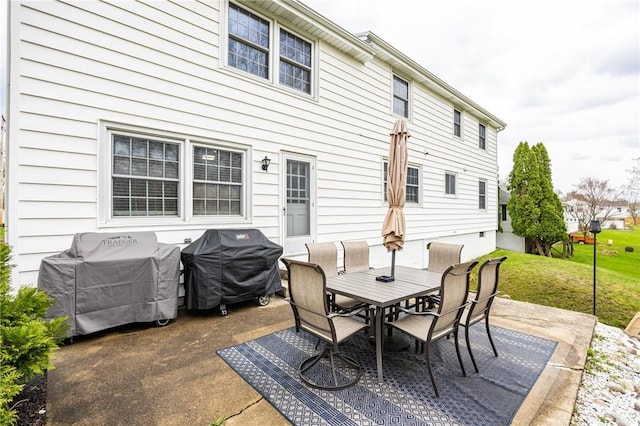 view of patio / terrace featuring outdoor dining area and a grill
