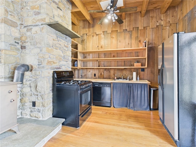 651 Dennis Hill Rd, Harrison, PA 16948 - kitchen with black appliances, open shelves, wood ceiling, beamed ceiling, and wood walls