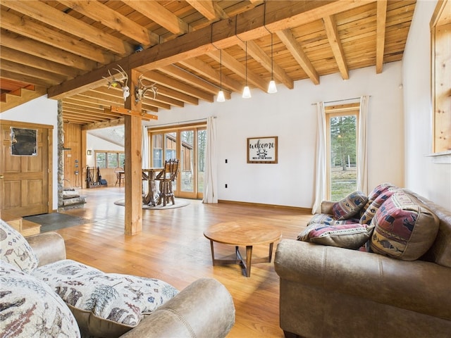 651 Dennis Hill Rd, Harrison, PA 16948 - living area with beam ceiling, wood finished floors, wooden ceiling, and baseboards