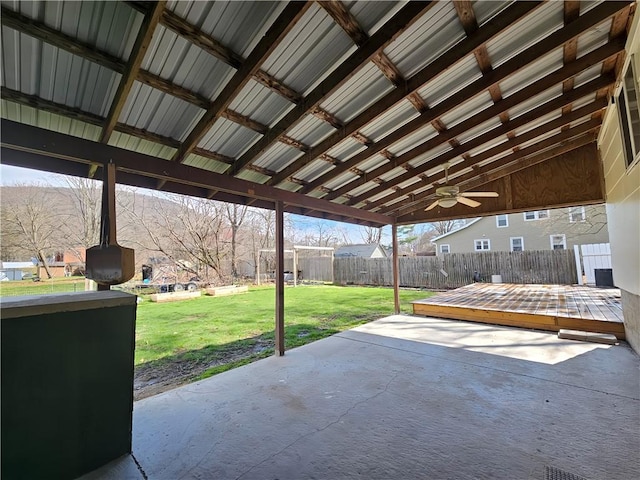 view of patio with a fenced backyard, a deck, and ceiling fan