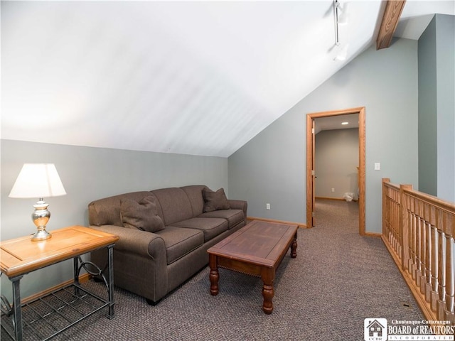 carpeted living area with vaulted ceiling and baseboards