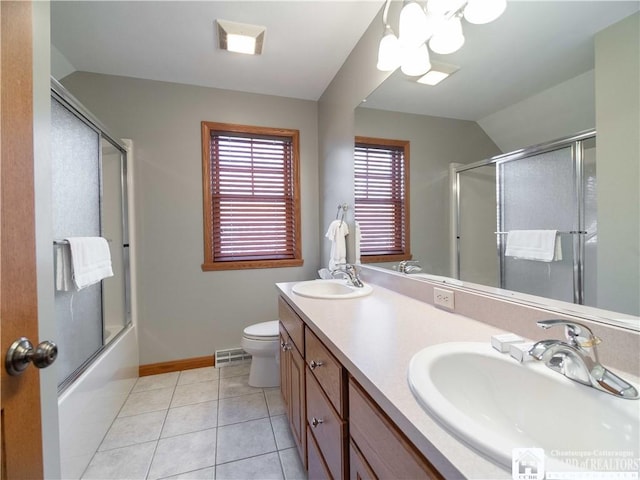 full bathroom with double vanity, visible vents, baseboards, and a sink