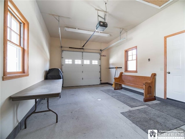 garage featuring baseboards and a garage door opener
