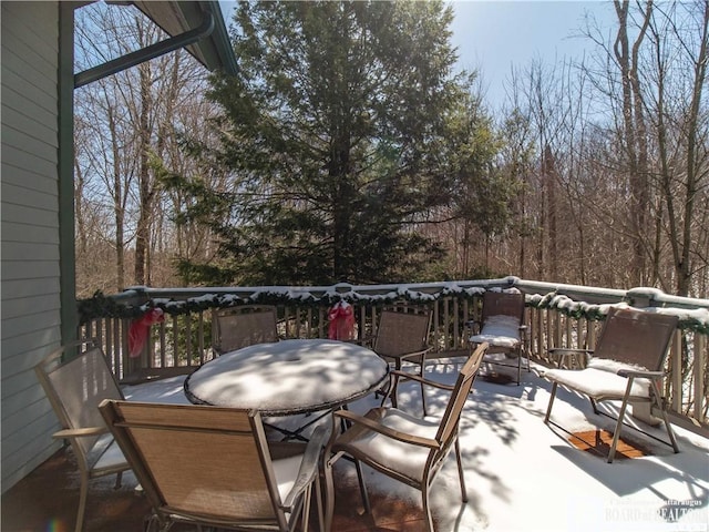 deck with outdoor dining area