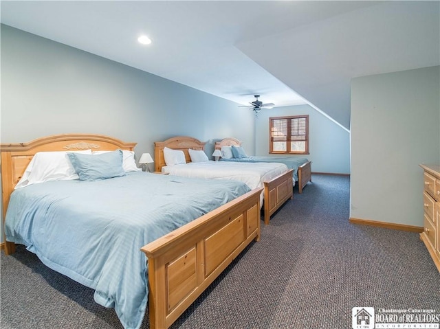 bedroom with baseboards and dark carpet