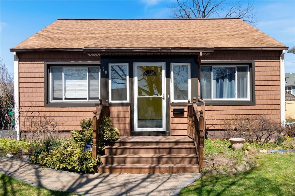 50 Brett Rd, Irondequoit, NY 14609 - property entrance featuring roof with shingles