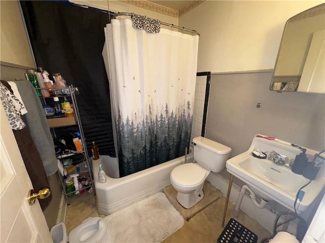 full bathroom with shower / tub combo, a sink, and toilet