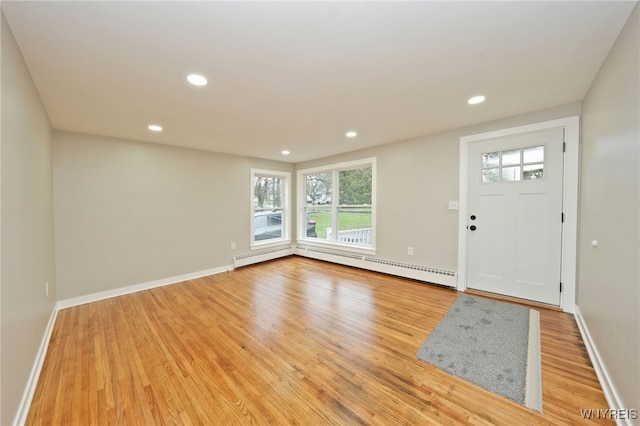 entrance foyer with recessed lighting, light wood-style flooring, a healthy amount of sunlight, and baseboard heating