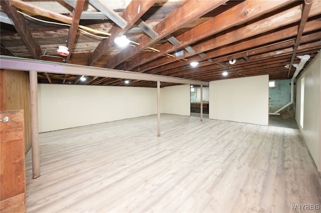 finished below grade area featuring wood finished floors