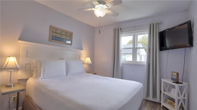 bedroom with wood finished floors and ceiling fan