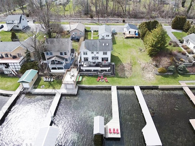birds eye view of property with a residential view and a water view