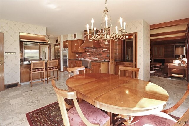 dining room featuring wallpapered walls, visible vents, and a chandelier