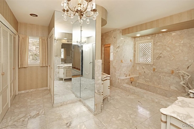 bathroom with an inviting chandelier, walk in shower, marble finish floor, a closet, and vanity