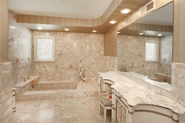 full bath with a bath, vanity, visible vents, and recessed lighting