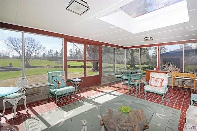 sunroom featuring outdoor dining area and a skylight