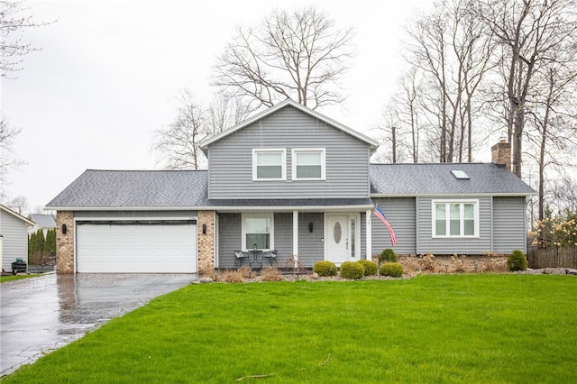 view of front of house with a front lawn, a chimney, covered porch, a garage, and aphalt driveway