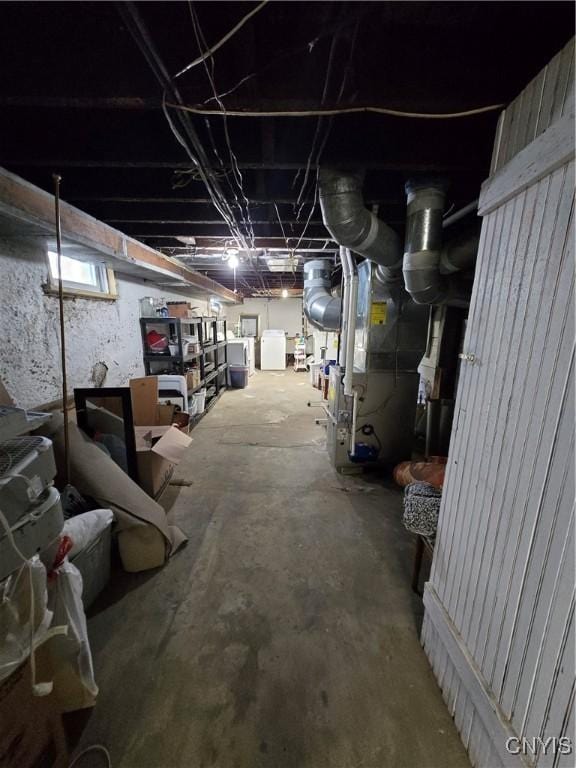 unfinished basement with washer / dryer