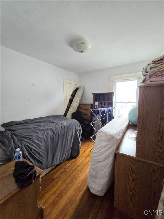 bedroom with wood finished floors