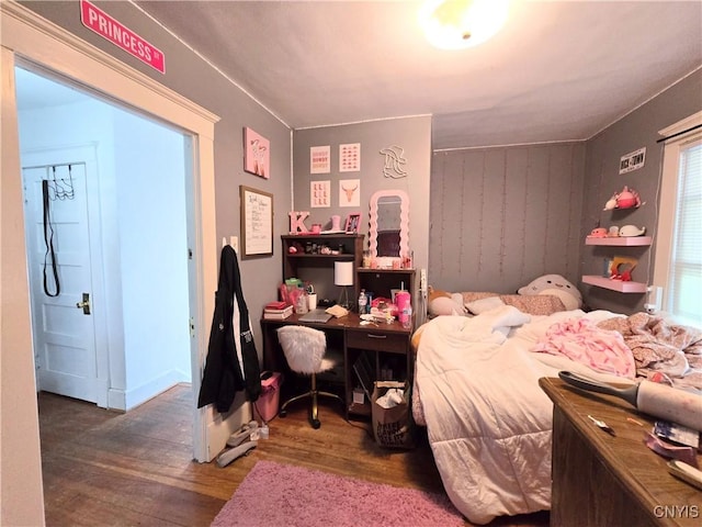 bedroom featuring wood finished floors