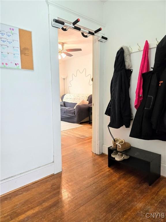 mudroom featuring a ceiling fan and wood finished floors