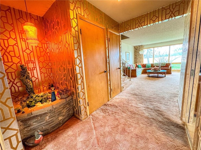hallway featuring carpet