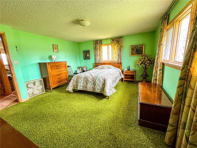 bedroom with carpet, a textured ceiling, and baseboards