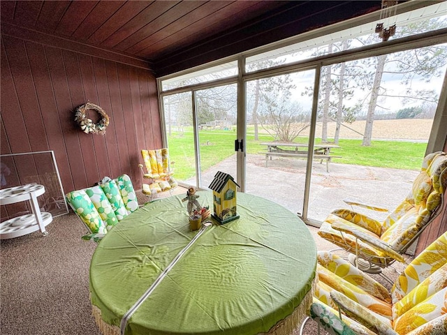 sunroom / solarium with outdoor dining area