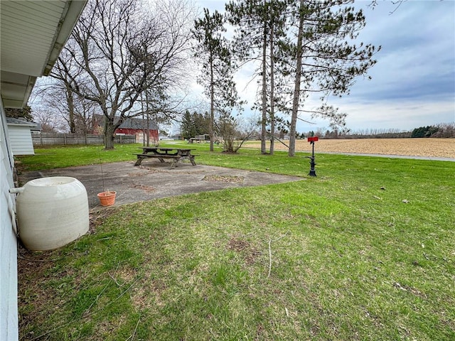 view of yard featuring fence and a patio area