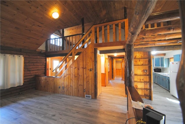 9221 Health St, North Dansville, NY 14437 - unfurnished living room with high vaulted ceiling, stairs, wooden ceiling, wood finished floors, and visible vents