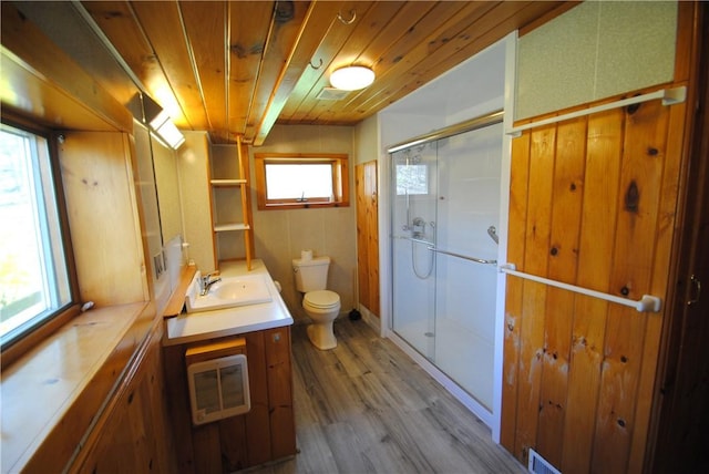 9221 Health St, North Dansville, NY 14437 - bathroom with vanity, toilet, heating unit, wooden ceiling, and a stall shower