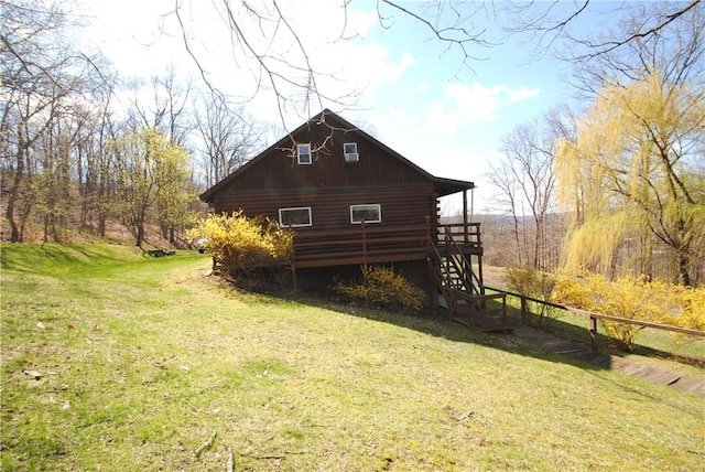 9221 Health St, North Dansville, NY 14437 - view of side of property with a wooden deck, fence, log siding, a yard, and stairway