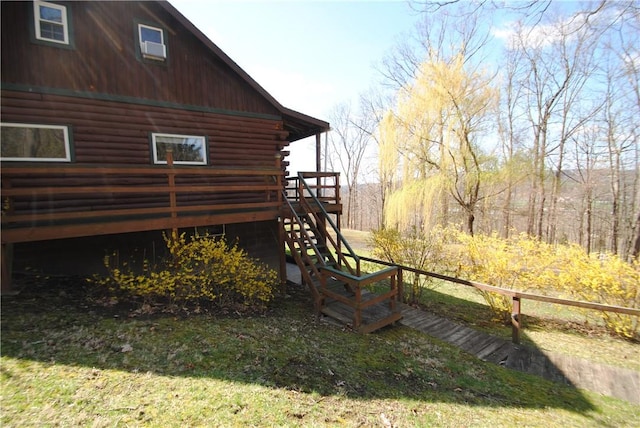 9221 Health St, North Dansville, NY 14437 - view of property exterior with log siding, a wooden deck, and stairs