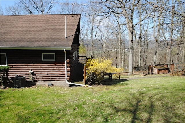 9221 Health St, North Dansville, NY 14437 - view of yard with fence, central air condition unit, and an outdoor structure