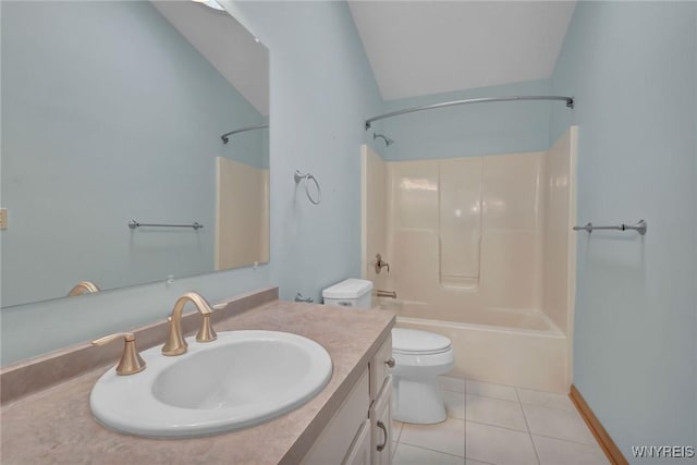 bathroom featuring toilet, vaulted ceiling, shower / washtub combination, tile patterned flooring, and vanity
