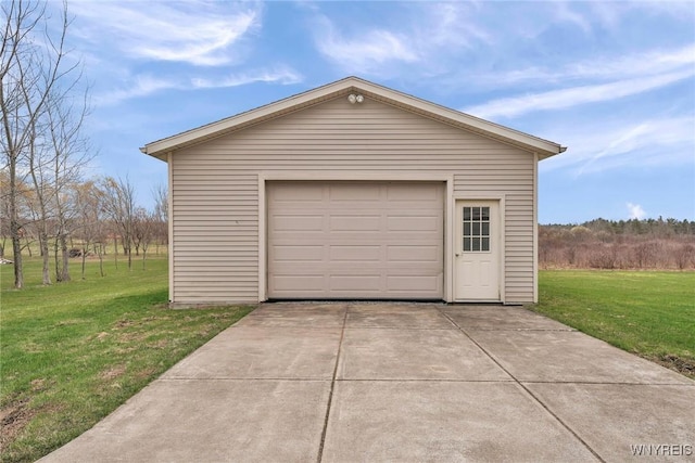 detached garage featuring driveway