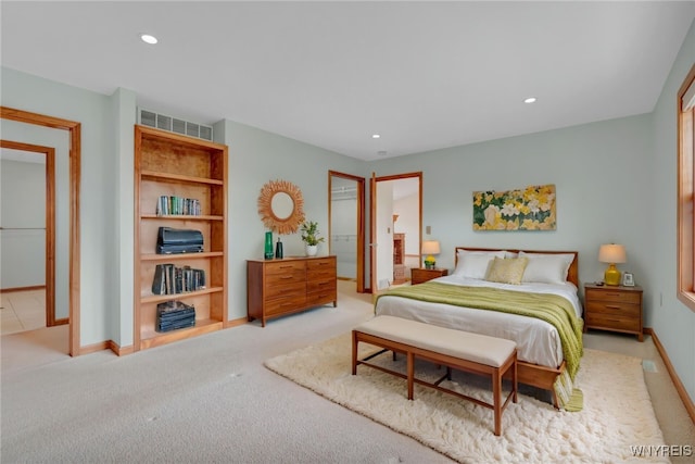 carpeted bedroom with baseboards, visible vents, and recessed lighting