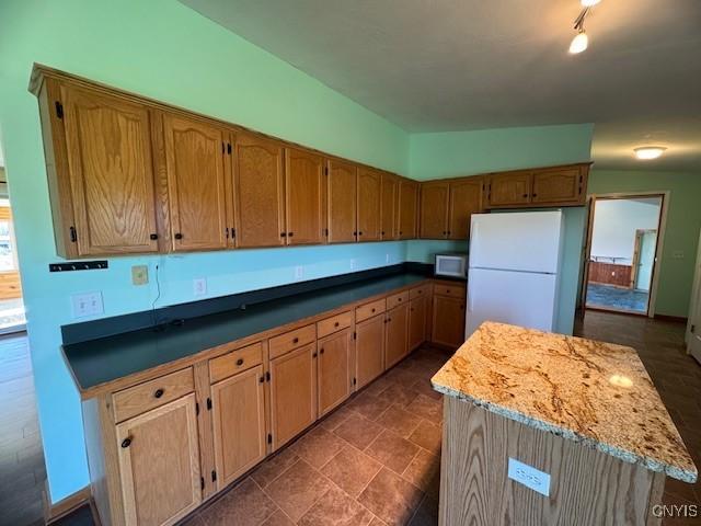 kitchen featuring a center island and white appliances