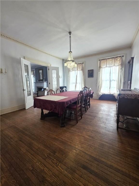 408 W Water St, Elmira-City, NY 14905 - dining space featuring a chandelier, baseboards, hardwood / wood-style flooring, and ornamental molding