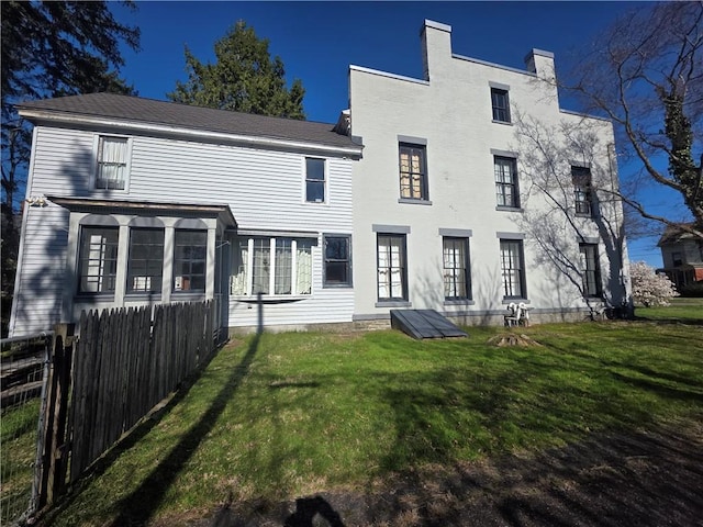 408 W Water St, Elmira-City, NY 14905 - rear view of property featuring fence and a yard