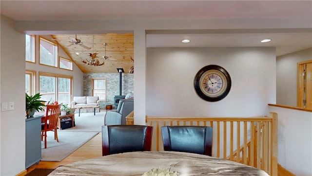 dining space with vaulted ceiling, a ceiling fan, wood finished floors, and recessed lighting
